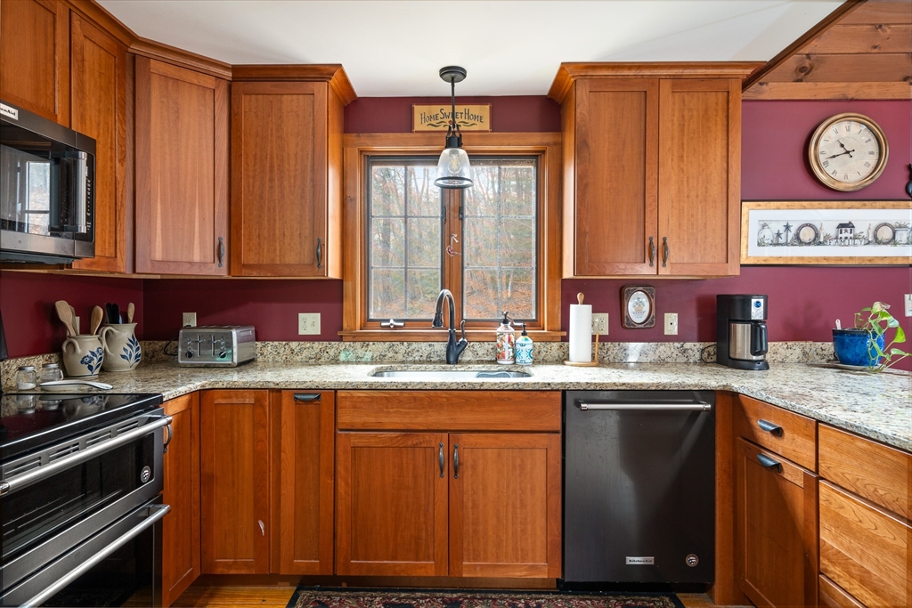 168 Brickyard Road Southampton, MA 01073 - Photo 11 of 42 a kitchen with stainless steel appliances granite countertop a sink stove and cabinets