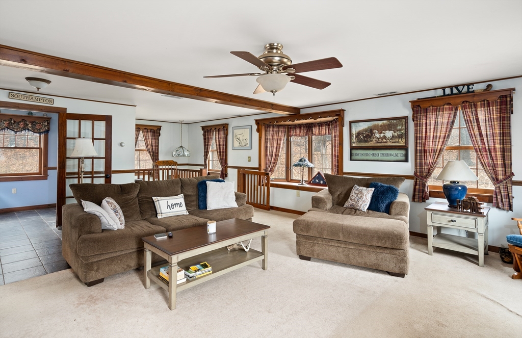168 Brickyard Road Southampton, MA 01073 - Photo 20 of 42 a living room with furniture and a large window