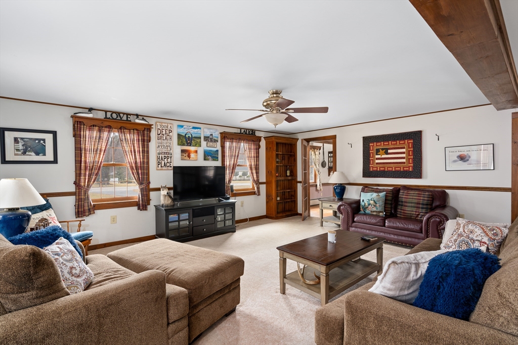 168 Brickyard Road Southampton, MA 01073 - Photo 21 of 42 a living room with furniture and a flat screen tv