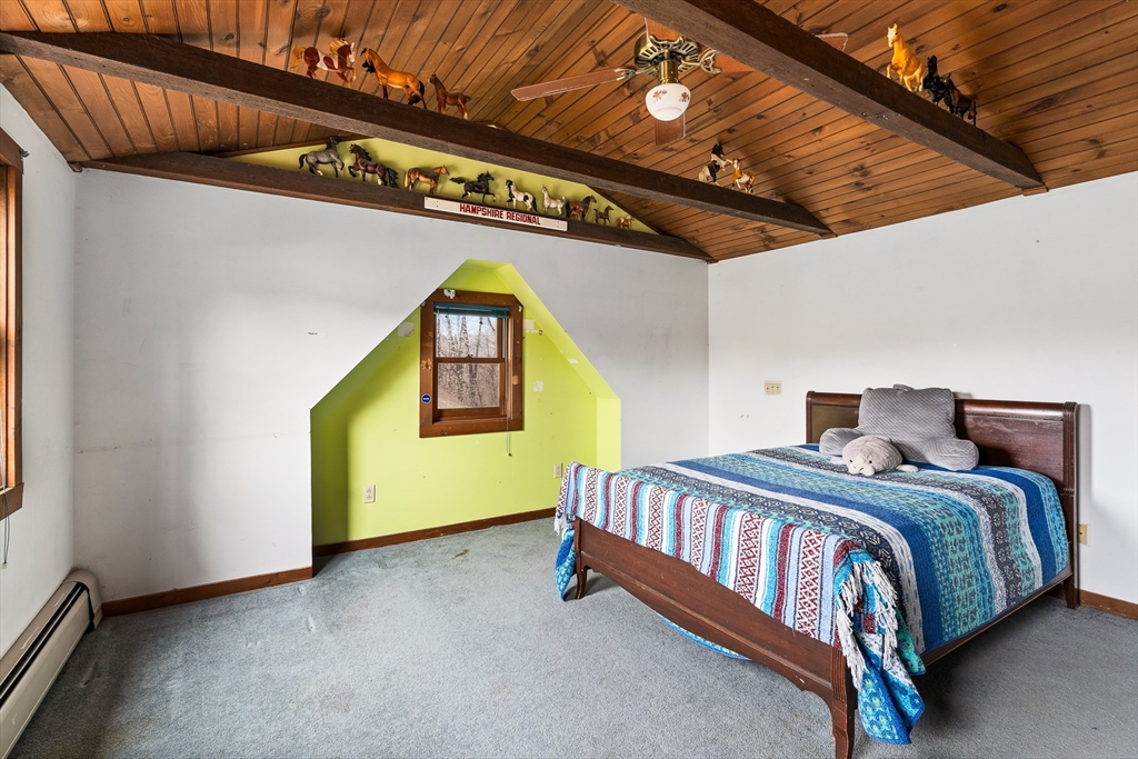 168 Brickyard Road Southampton, MA 01073 - Photo 34 of 42 a bedroom with a bed and a ceiling fan
