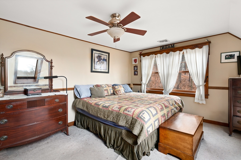 168 Brickyard Road Southampton, MA 01073 - Photo 38 of 42 a bedroom with a bed a window and dresser