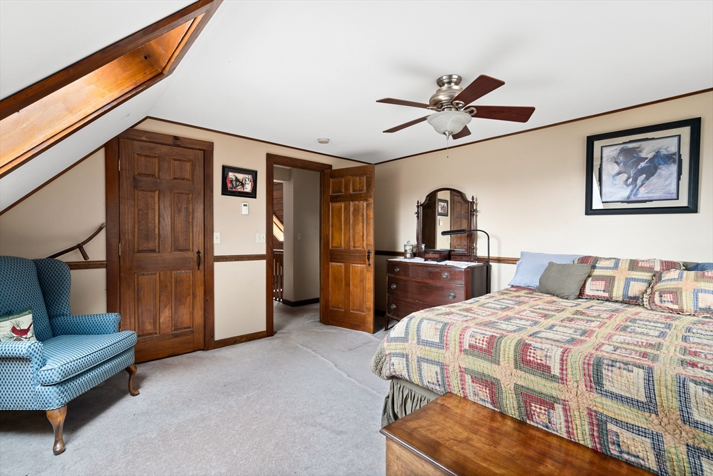 168 Brickyard Road Southampton, MA 01073 - Photo 39 of 42 a bedroom with a bed and a refrigerator