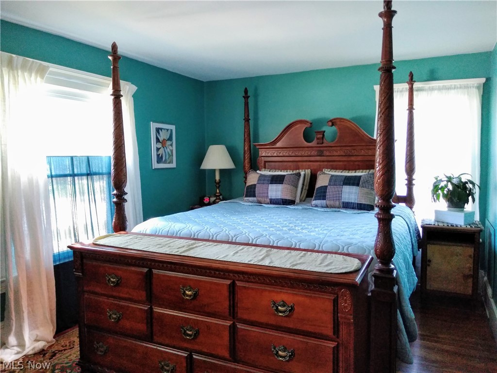 12 East Schaaf Road Independence, OH 44131 - Photo 23 of 33 Master Bedroom with walk in closet and hardwood floors