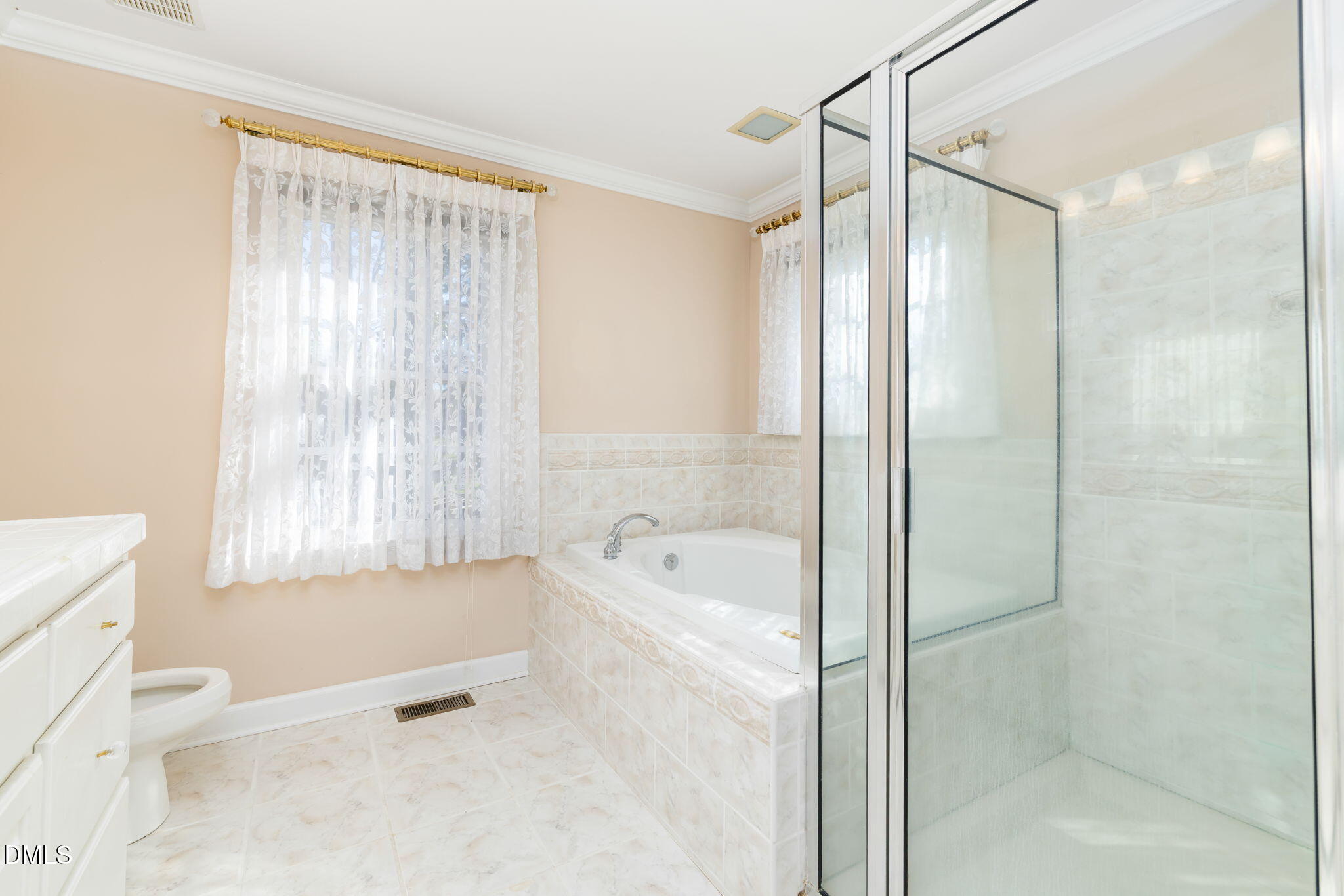 4076 Salem Farm Road Oxford, NC 27565 - Photo 24 of 55 a bathroom with a bathtub shower and a toilet