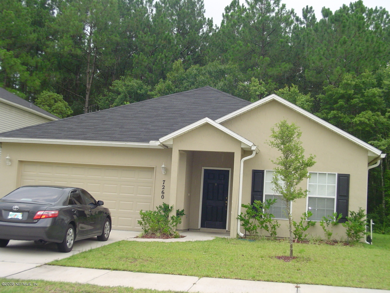 7260 Rampart Ridge Circle West Jacksonville, FL 32244 - Photo 1 of 16 a view of a house with yard and tree s