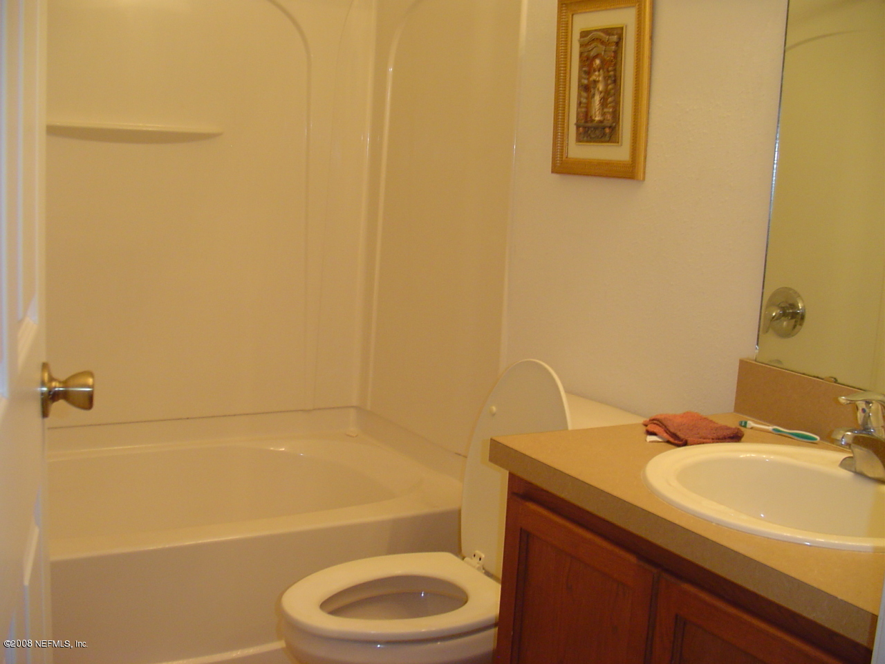 7260 Rampart Ridge Circle West Jacksonville, FL 32244 - Photo 7 of 16 a bathroom with a sink a toilet and a bathtub