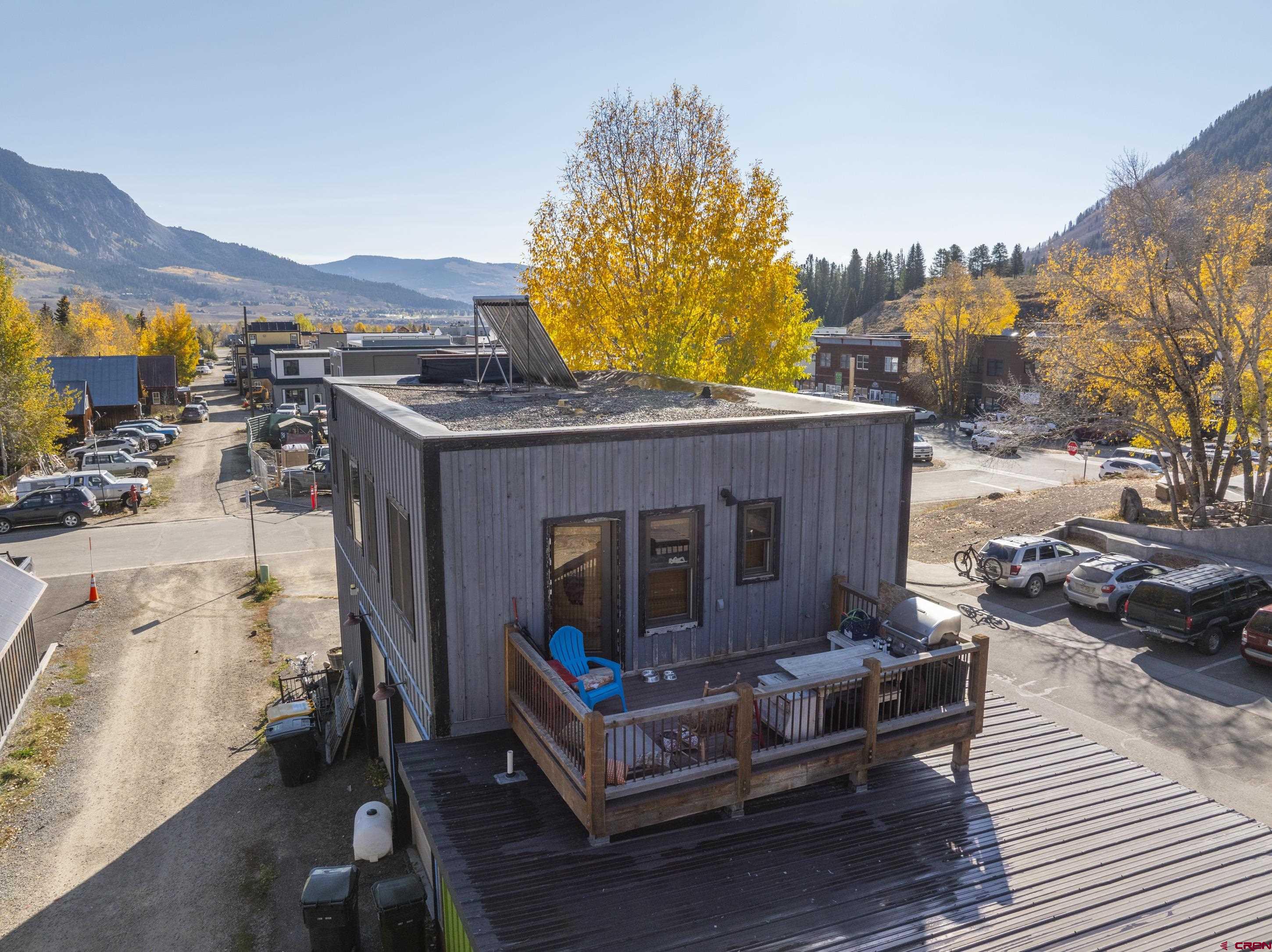 611 3rd Street, Unit A & B Crested Butte, CO 81224 - Photo 21 of 34 a view of roof deck with couches and wooden floor