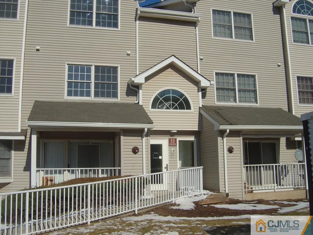 717 Edpas Road, Unit 717 New Brunswick, NJ 08901 - Photo 1 of 1 a front view of a house with a porch