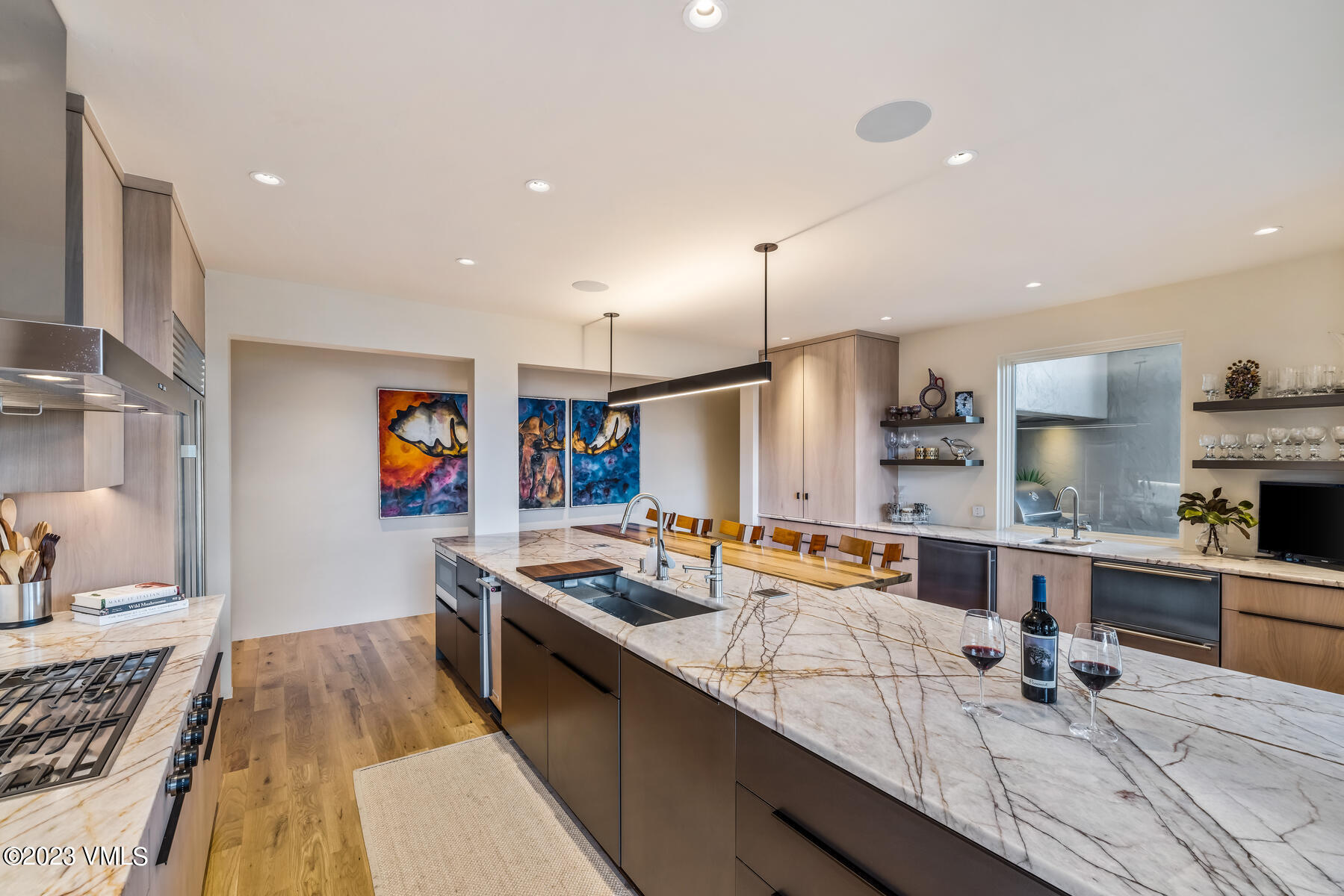 81 Elk Run Edwards, CO 81632 - Photo 13 of 62 a large kitchen with stainless steel appliances a large counter top space a sink and a couch