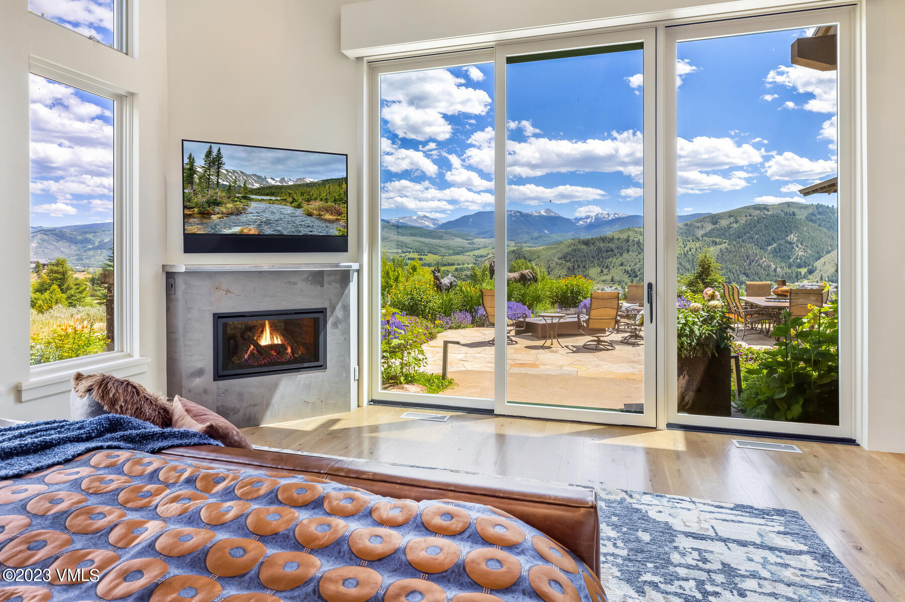 81 Elk Run Edwards, CO 81632 - Photo 27 of 62 a living room with a fireplace and a floor to ceiling window
