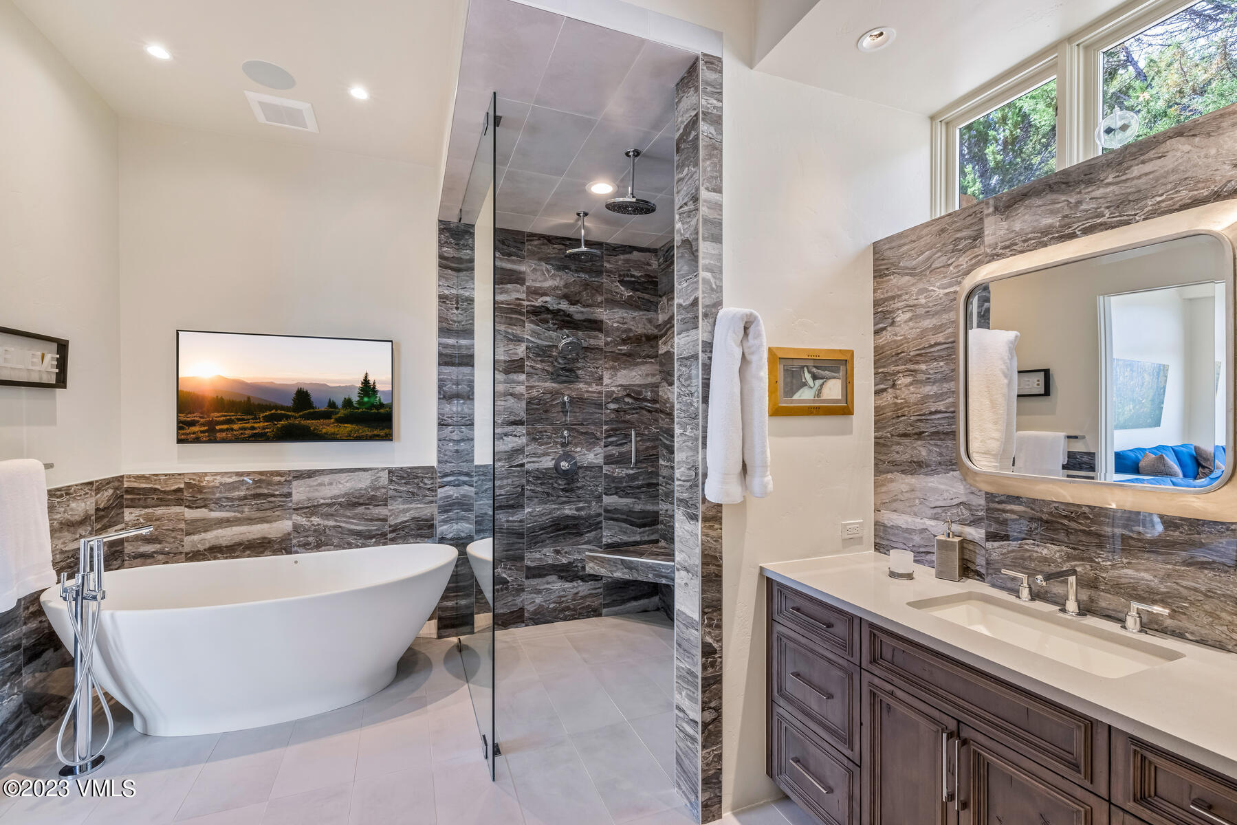 81 Elk Run Edwards, CO 81632 - Photo 28 of 62 a bathroom with a bathtub sink and mirror
