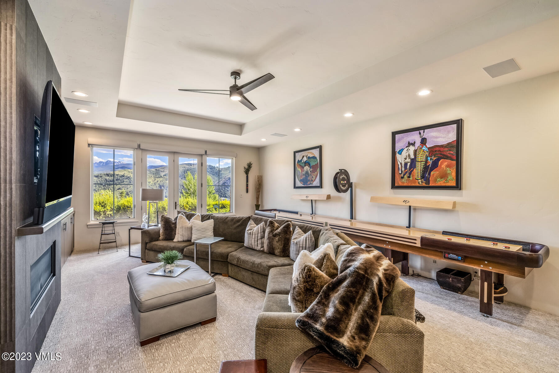 81 Elk Run Edwards, CO 81632 - Photo 38 of 62 a living room with furniture ceiling fan and a flat screen tv