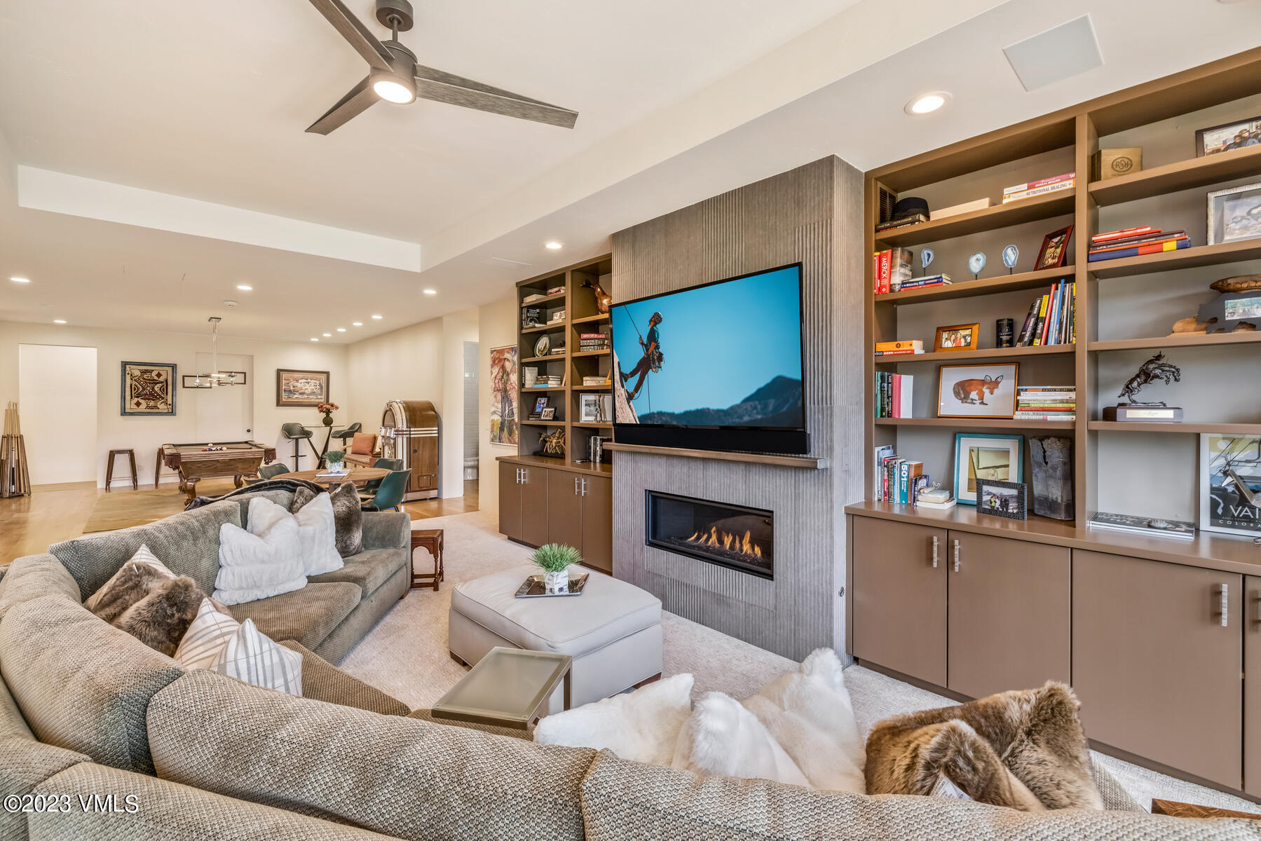 81 Elk Run Edwards, CO 81632 - Photo 39 of 62 a living room with furniture a flat screen tv and a fireplace