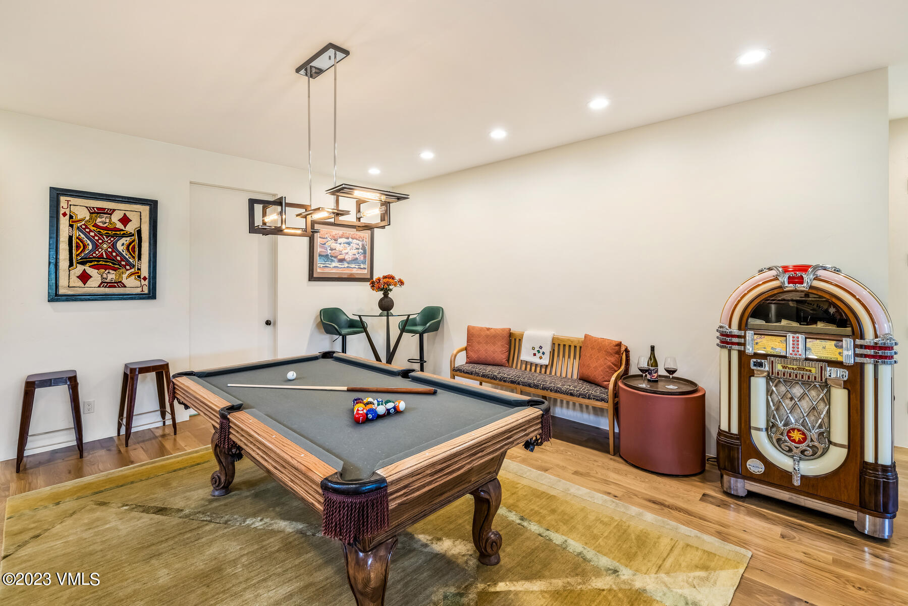 81 Elk Run Edwards, CO 81632 - Photo 40 of 62 a living room with furniture a rug and a chandelier