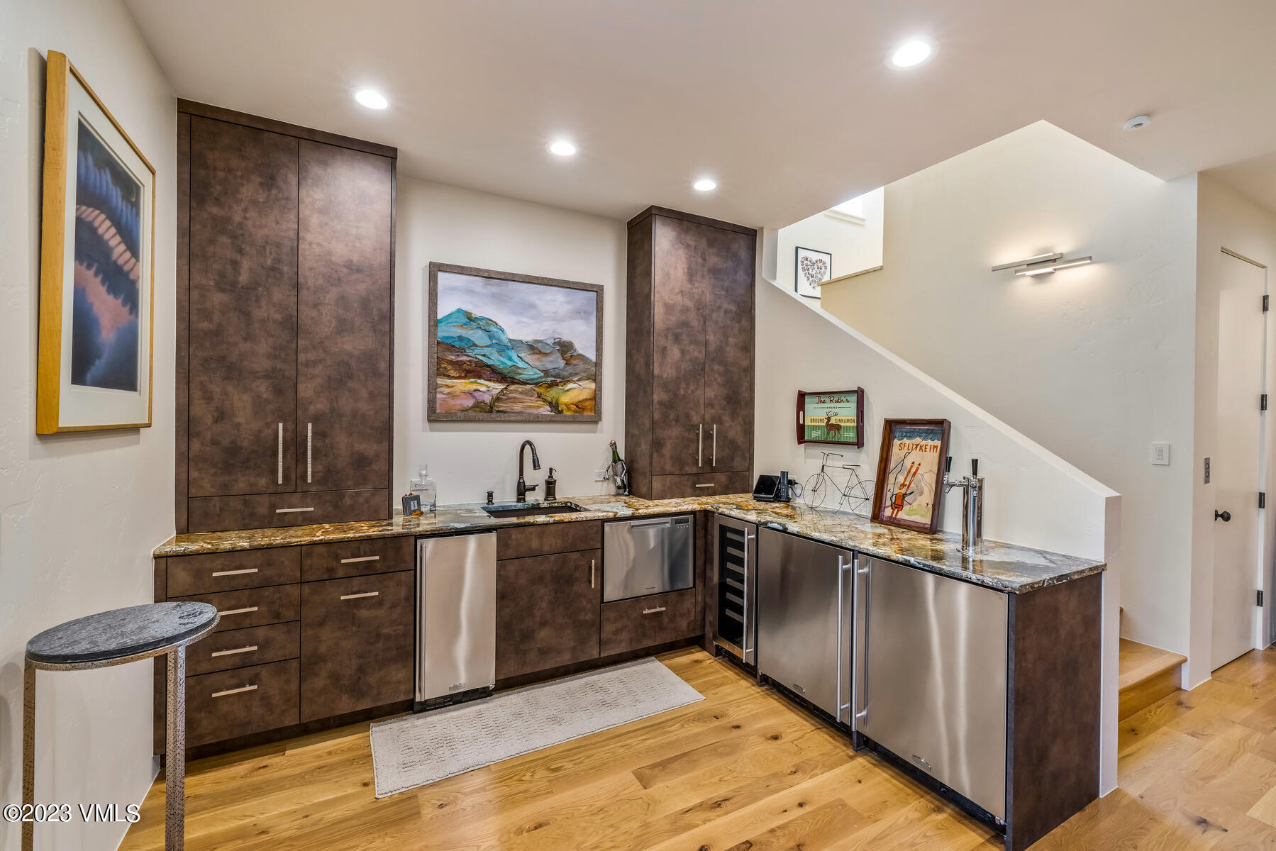 81 Elk Run Edwards, CO 81632 - Photo 41 of 62 a kitchen with stainless steel appliances granite countertop a sink stove and wooden cabinets