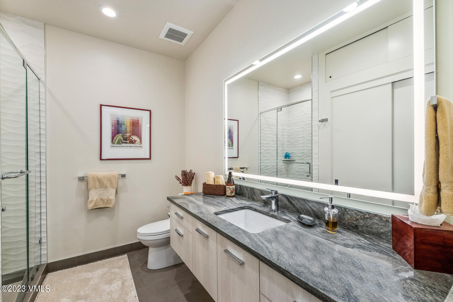 81 Elk Run Edwards, CO 81632 - Photo 47 of 62 a large bathroom with a granite countertop double vanity sink a mirror and a toilet