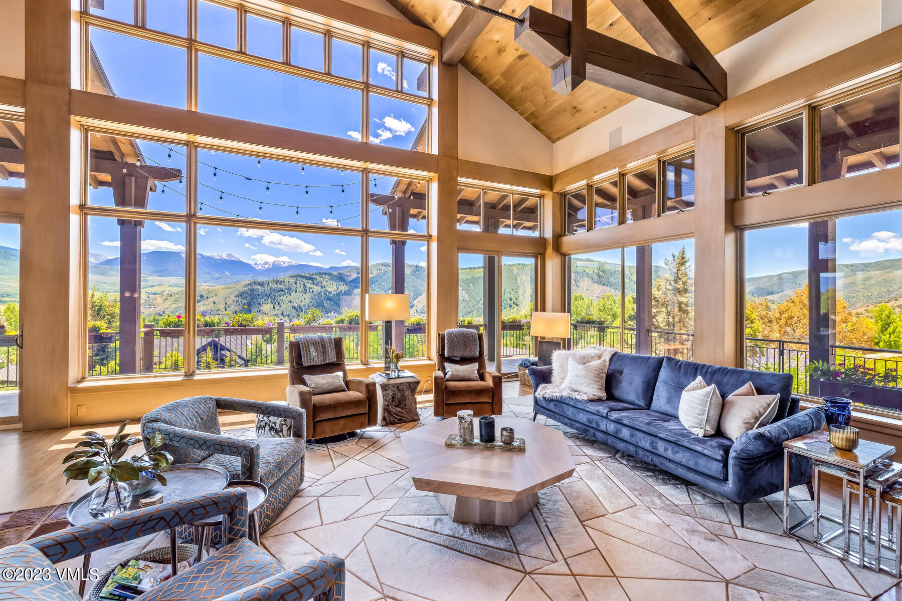81 Elk Run Edwards, CO 81632 - Photo 6 of 62 a living room with furniture a large window and a potted plant