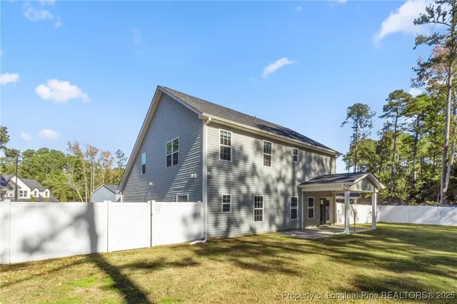 a view of house with outdoor space and swimming pool