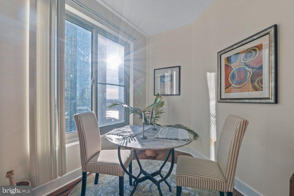 675 President Street, Unit 1404 Baltimore, MD 21202 - Photo 17 of 31 a view of a dining room with furniture window and wooden floor