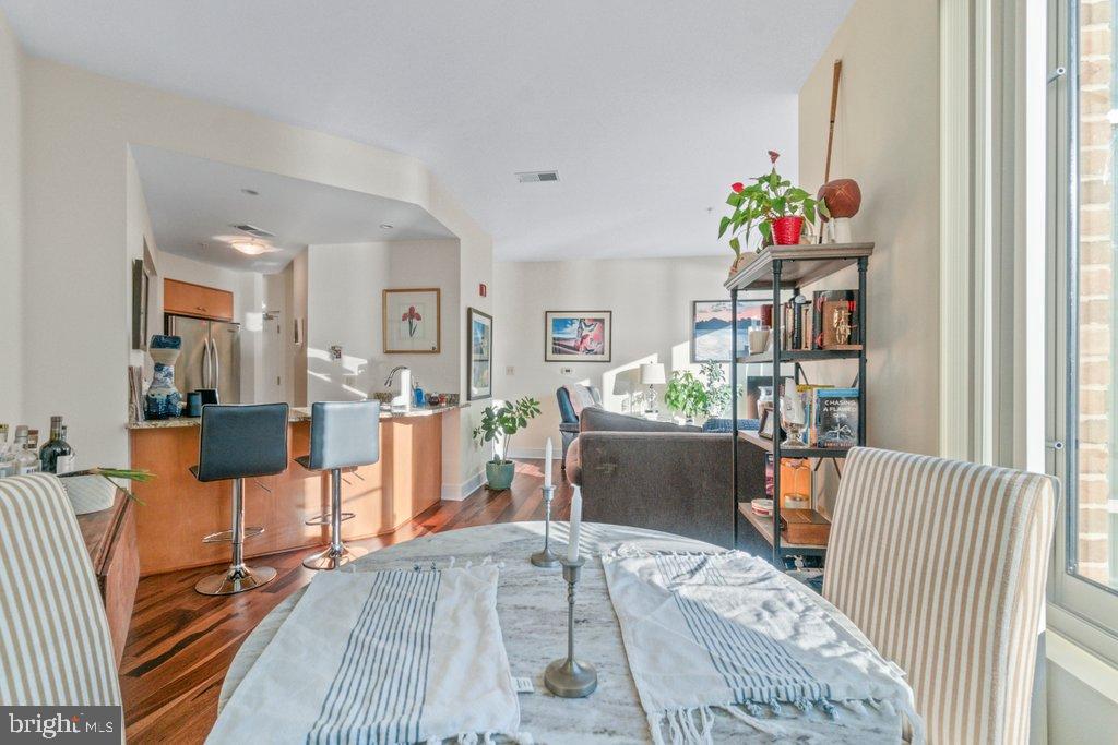 675 President Street, Unit 1404 Baltimore, MD 21202 - Photo 18 of 31 a living room filled with furniture and wooden floor