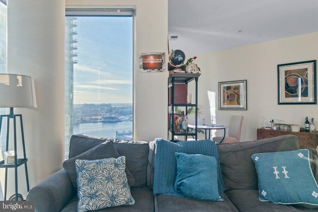 675 President Street, Unit 1404 Baltimore, MD 21202 - Photo 21 of 31 a living room with furniture and a window