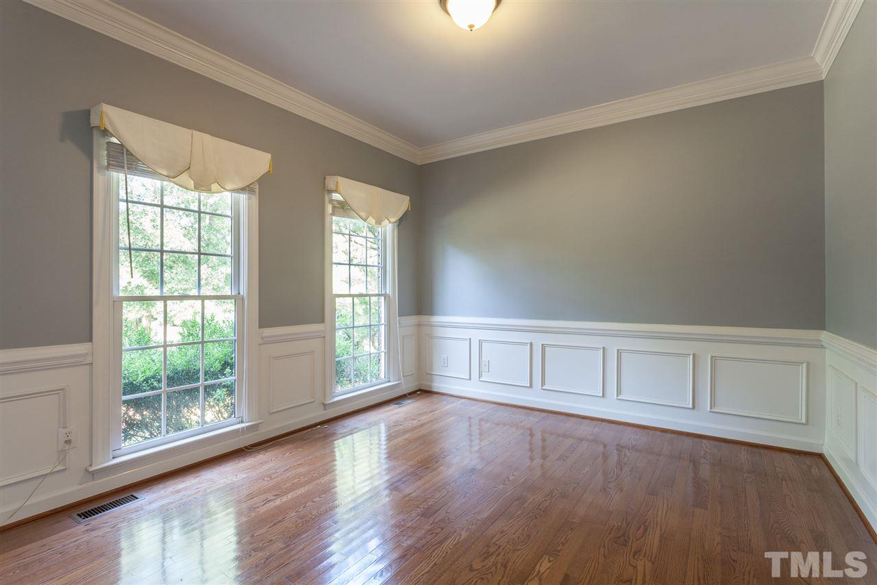 2613 Lizei Street Raleigh, NC 27616 - Photo 11 of 25 an empty room with wooden floor and windows