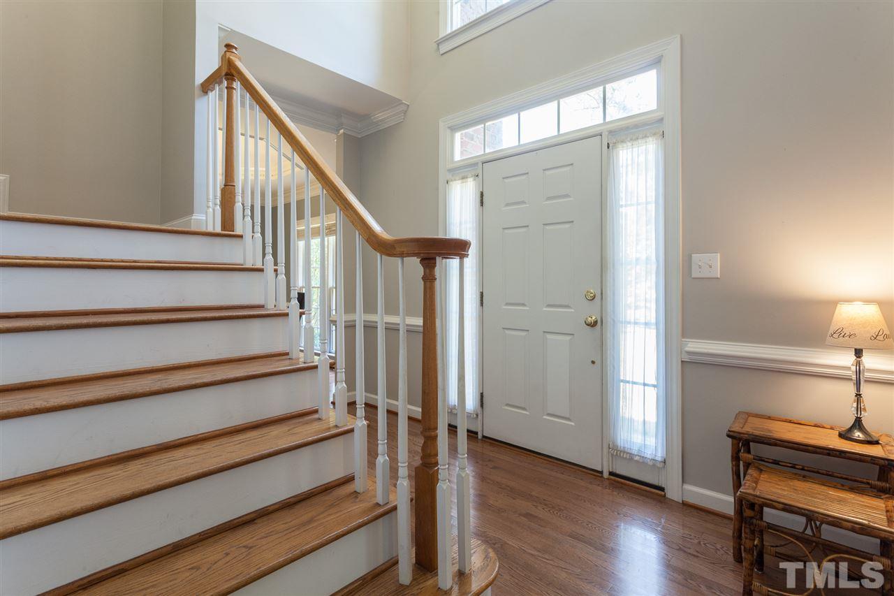 2613 Lizei Street Raleigh, NC 27616 - Photo 12 of 25 a view of a hallway with wooden floor and staircase