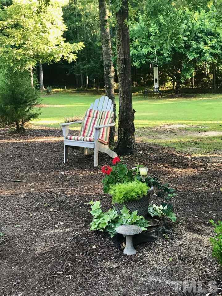 2613 Lizei Street Raleigh, NC 27616 - Photo 14 of 25 a view of a park with large trees and a yard