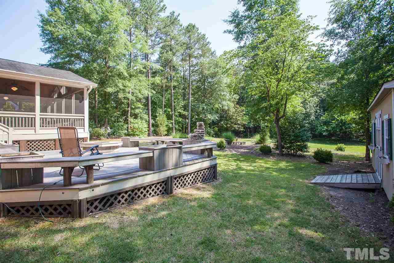 2613 Lizei Street Raleigh, NC 27616 - Photo 16 of 25 a view of a house with backyard and sitting area