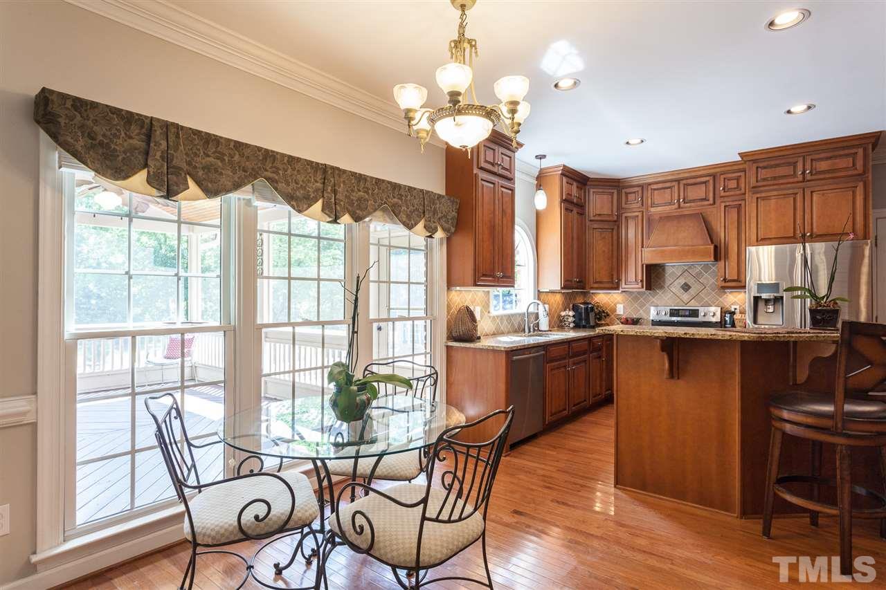 2613 Lizei Street Raleigh, NC 27616 - Photo 7 of 25 a kitchen that has a table and chairs in it