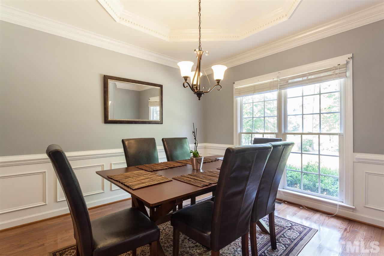 2613 Lizei Street Raleigh, NC 27616 - Photo 10 of 25 a view of a dining room with furniture window and wooden floor