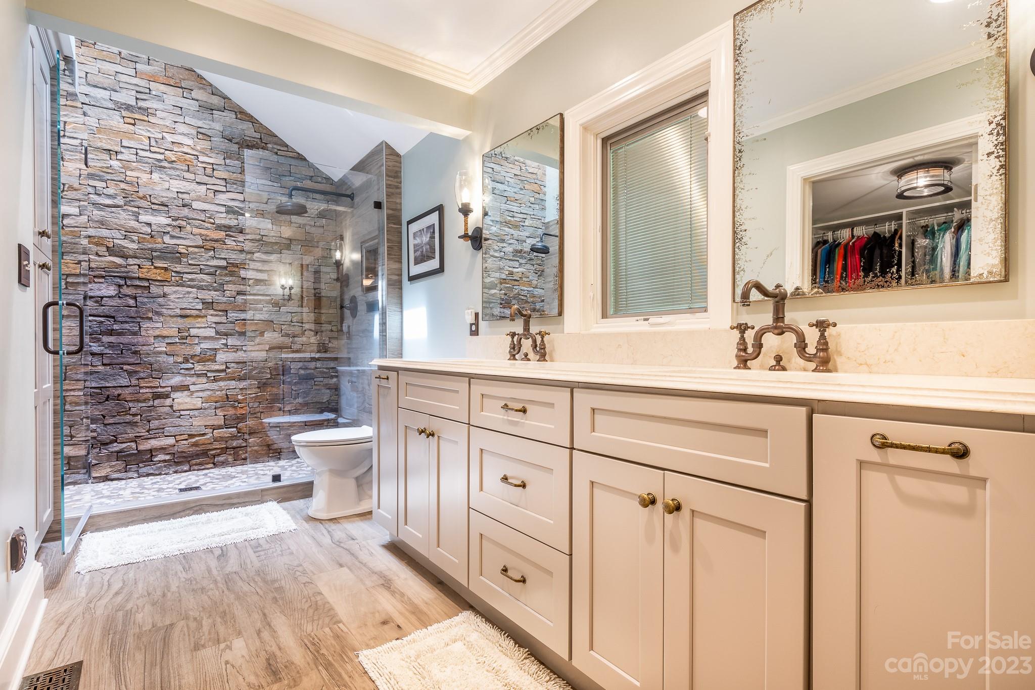 3787 Mill Run Terrell, NC 28682 - Photo 13 of 42 a bathroom with a granite countertop sink a toilet a mirror and shower