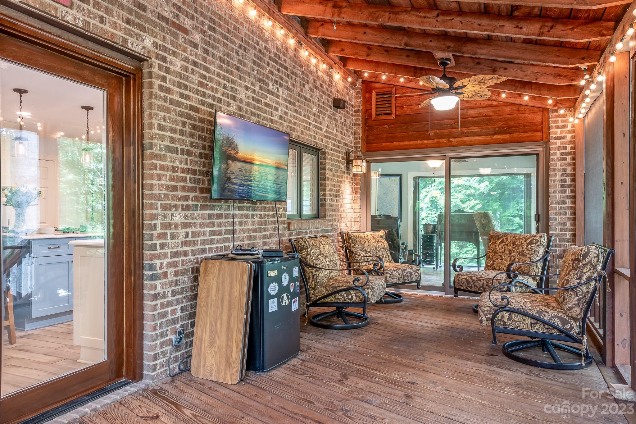 3787 Mill Run Terrell, NC 28682 - Photo 15 of 42 a balcony with furniture and a fireplace