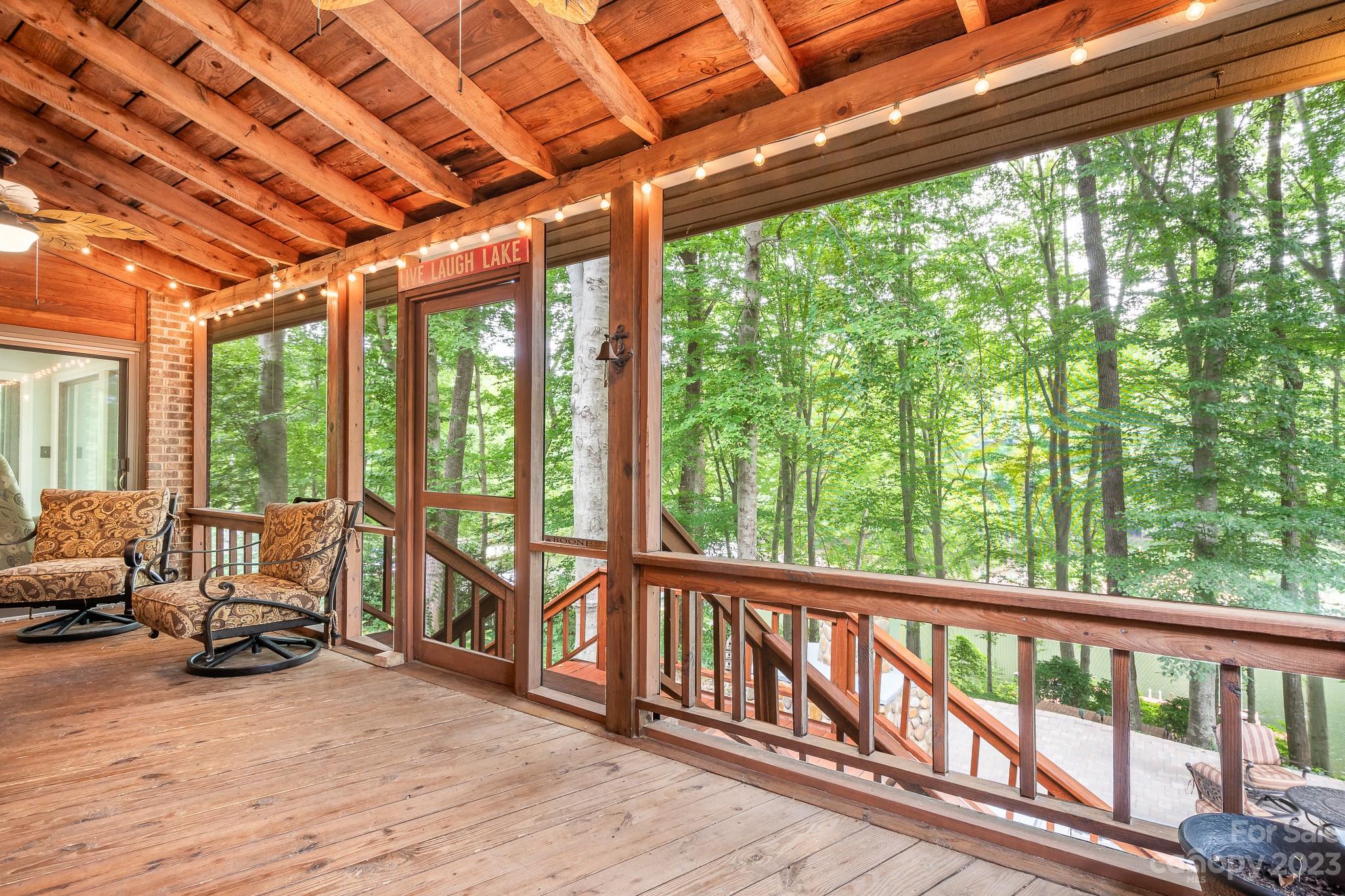 3787 Mill Run Terrell, NC 28682 - Photo 16 of 42 a view of a balcony with couch and wooden floor
