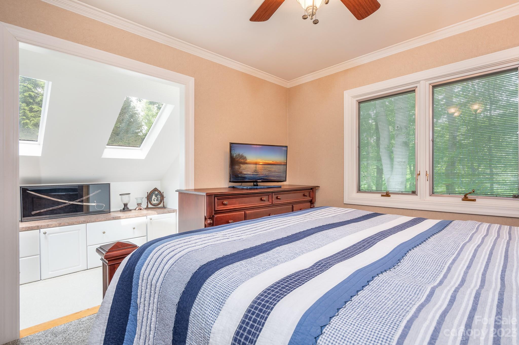 3787 Mill Run Terrell, NC 28682 - Photo 18 of 42 a bedroom with a bed and a flat screen tv