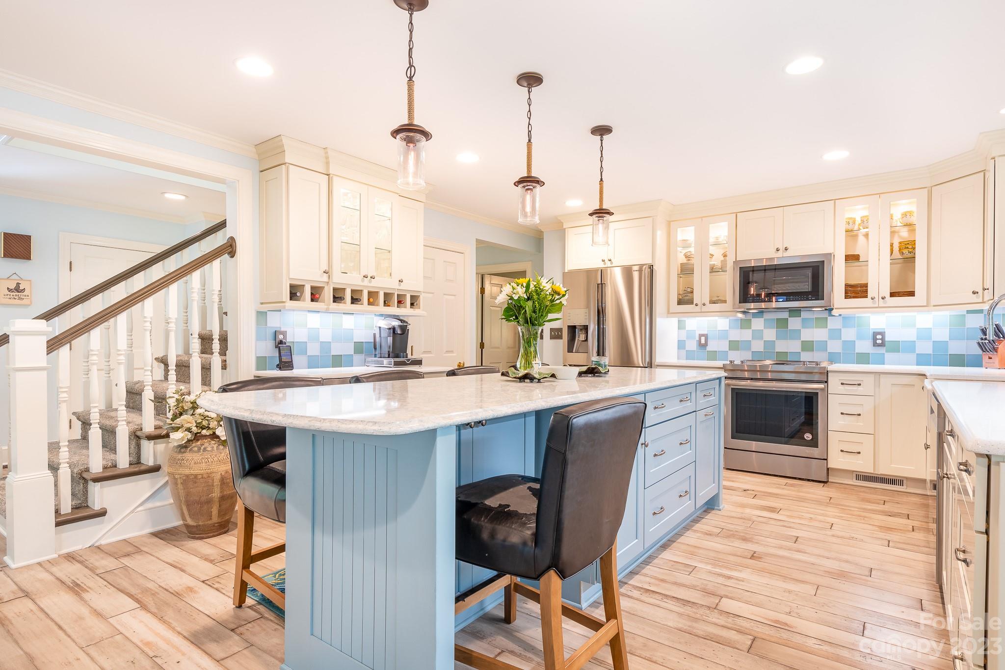 3787 Mill Run Terrell, NC 28682 - Photo 2 of 42 a kitchen with a table chairs stove and kitchen island