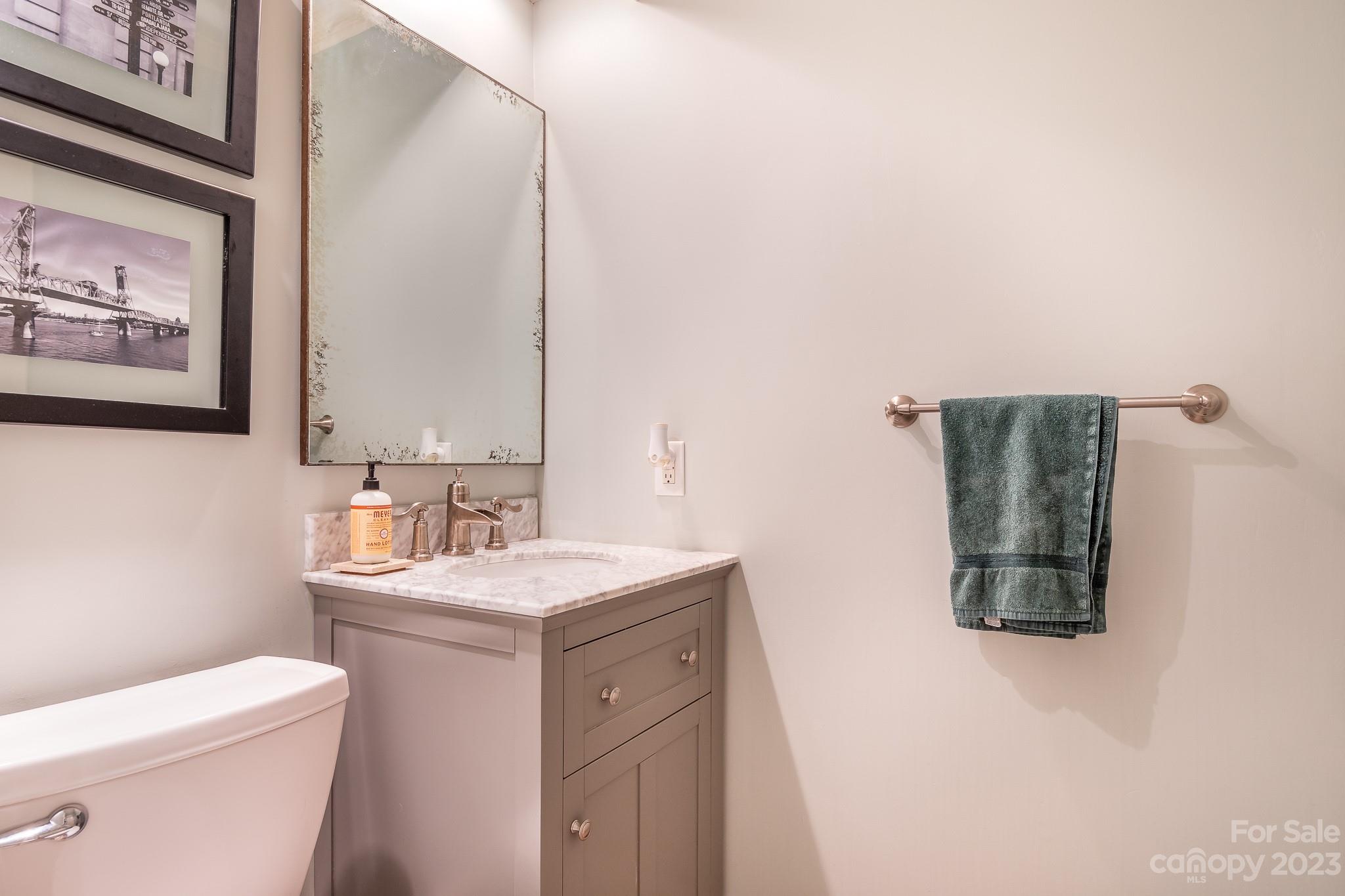 3787 Mill Run Terrell, NC 28682 - Photo 25 of 42 a bathroom with a toilet sink and mirror