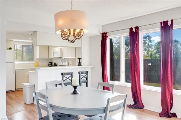 a view of kitchen with a dining table and chairs