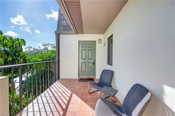 a balcony view with chair and table