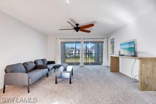 1645 Spoonbill Lane, Unit C Naples, FL 34105 - Photo 3 of 50 Living room with light colored carpet and ceiling fan