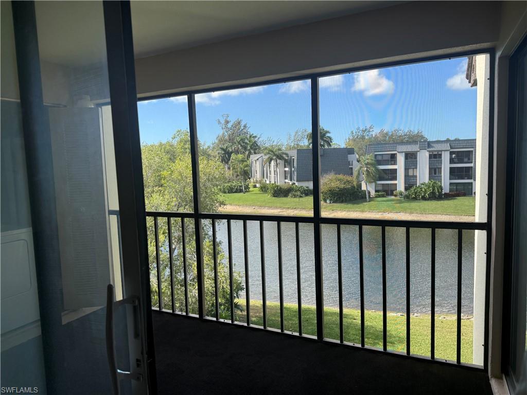 1645 Spoonbill Lane, Unit C Naples, FL 34105 - Photo 32 of 50 Balcony with a sunroom and a water view