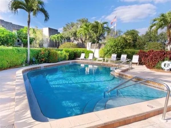 a view of a swimming pool with a patio
