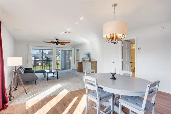 a view of a dining room with furniture window and outside view