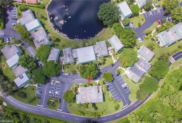 an aerial view of residential houses with outdoor space