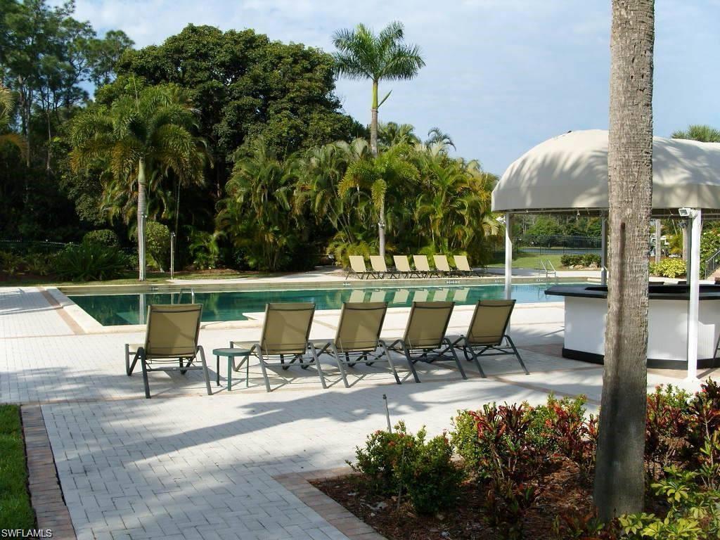 1645 Spoonbill Lane, Unit C Naples, FL 34105 - Photo 46 of 50 Community pool with a patio