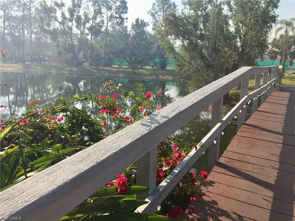a view of a flower in a balcony with wooden floor