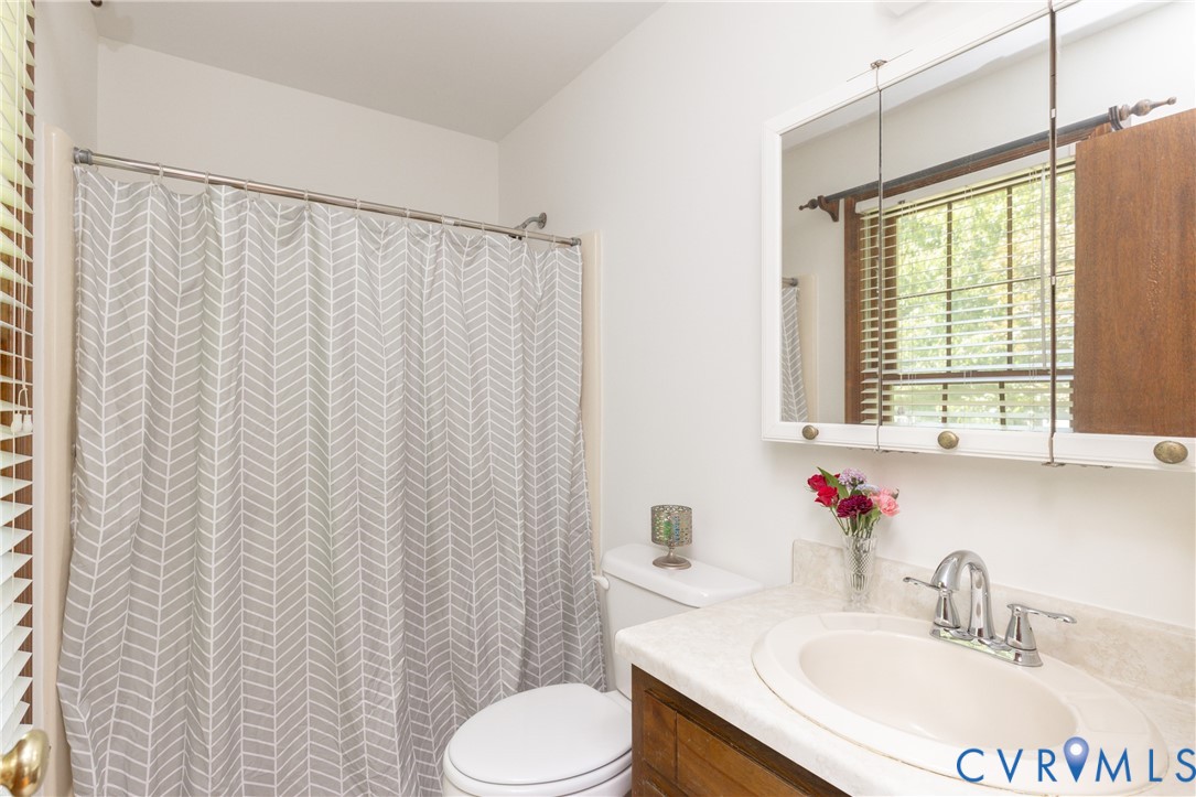 617 Rebel Ridge Road Colonial Heights, VA 23834 - Photo 35 of 49 a bathroom with a granite countertop sink and a mirror