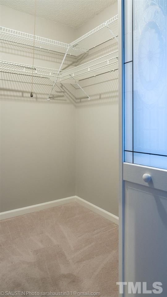2417 Tusket Court Raleigh, NC 27613 - Photo 20 of 25 Master bedroom has a walk-in closet.