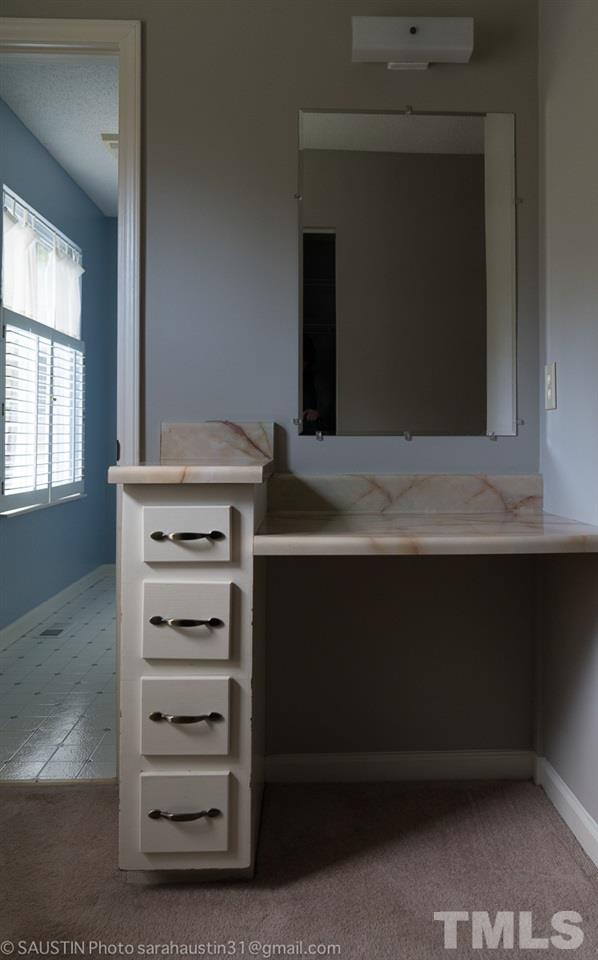 2417 Tusket Court Raleigh, NC 27613 - Photo 21 of 25 Master bedroom has a vanity.