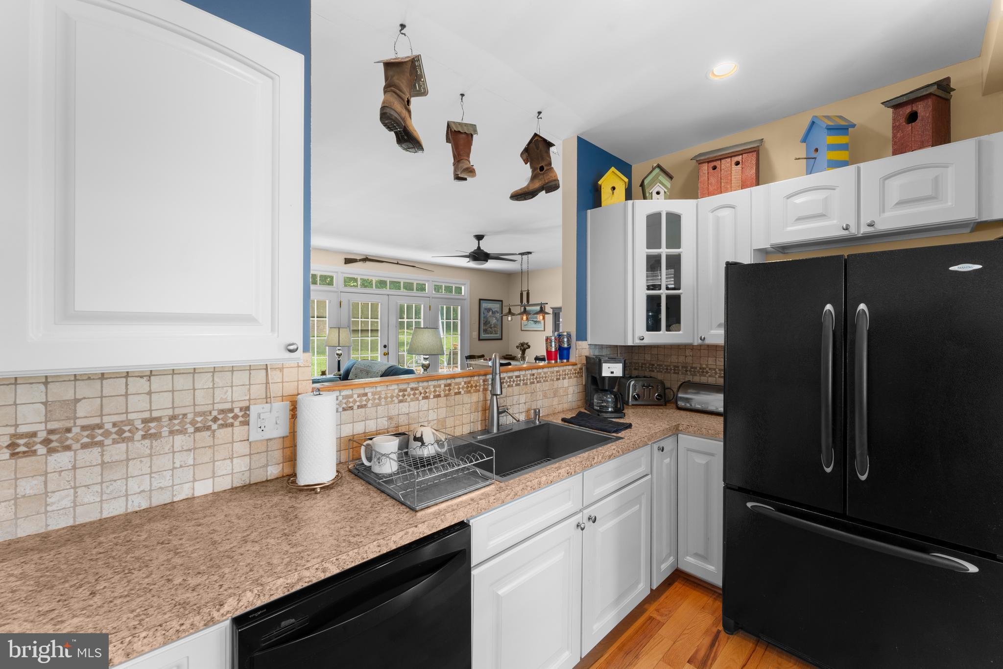 8260 River Hills Lane Rixeyville, VA 22737 - Photo 21 of 104 a kitchen with stainless steel appliances granite countertop a sink stove and refrigerator